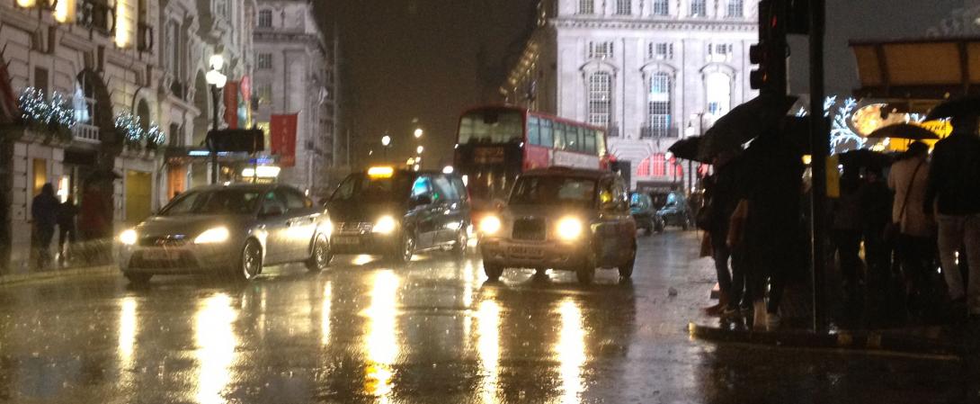 Taxis in rainy London